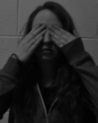 A photo of Martina Browne covering her eyes