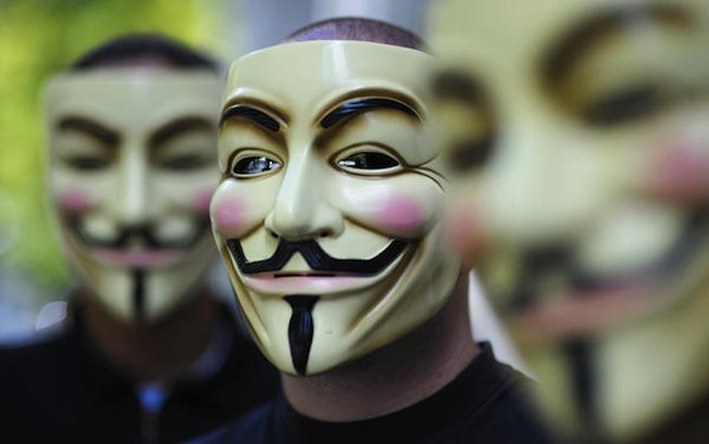 Members Of Anonymous Wearing Guy Fawkes Masks